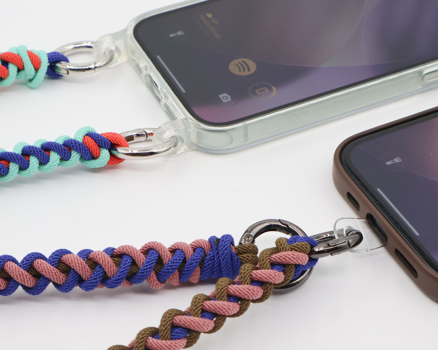 How Charmolé macramé straps connect to phones — spring clip through a clear case strap ring and direct phone attachment patch