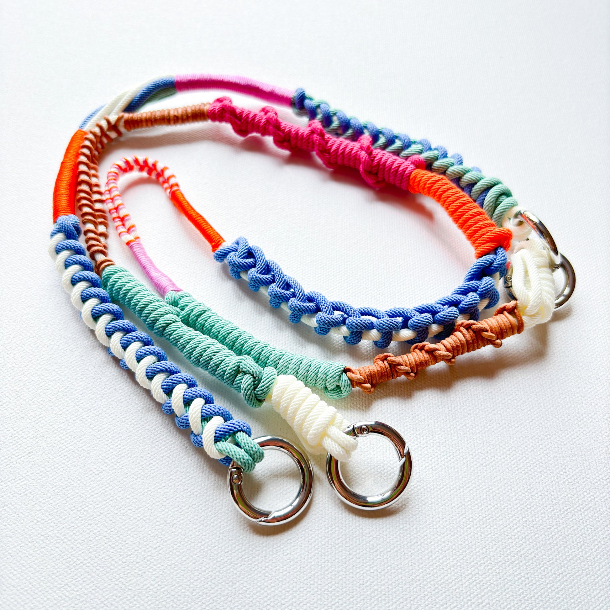 Colorful handmade crossbody phone strap on white background