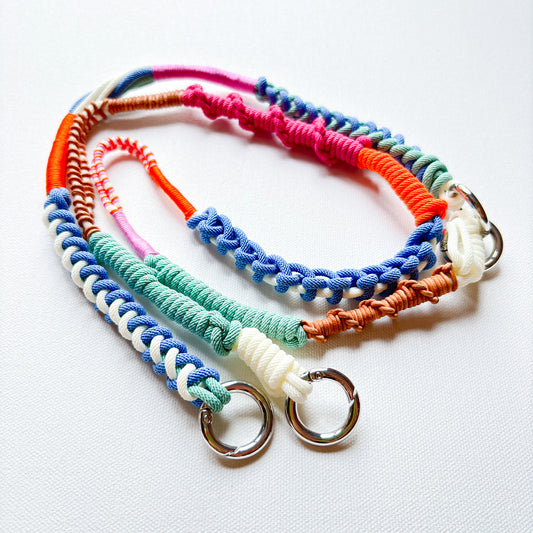 Colorful handmade crossbody phone strap on white background