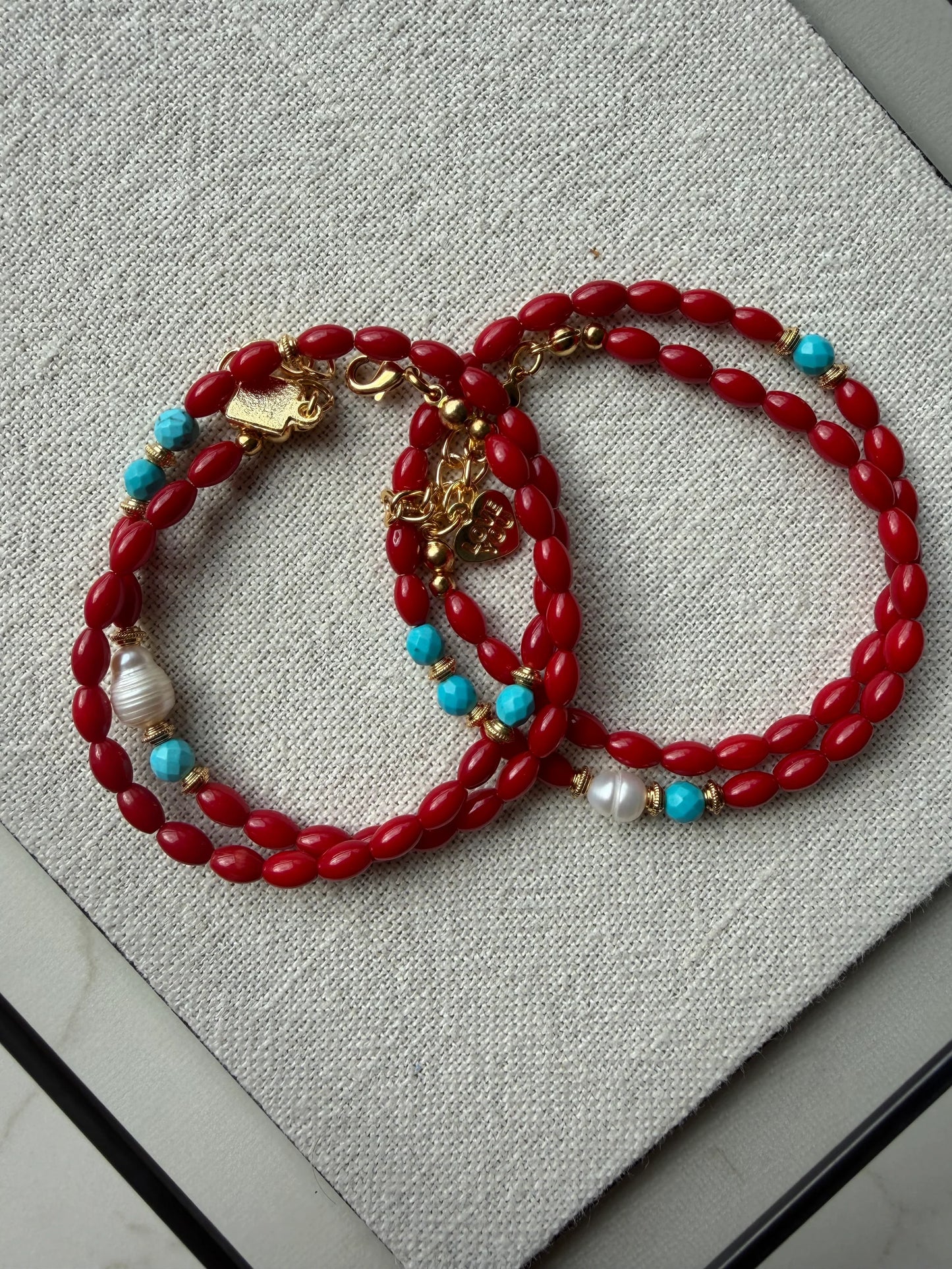 Coralyn Sol Coral Necklace displayed on canvas cloth