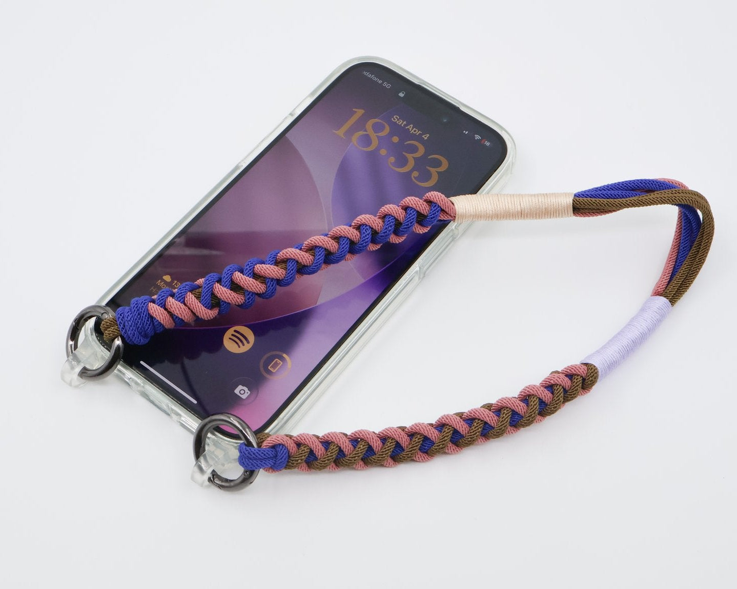 Smartphone with a braided phone strap on a white background