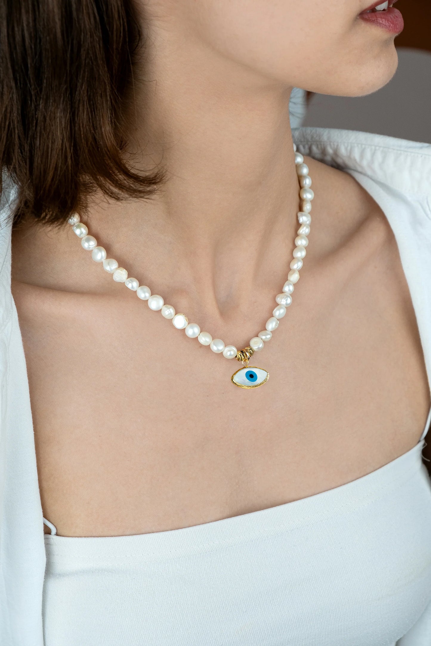 Guardian Pearl Necklace worn on a woman's chest
