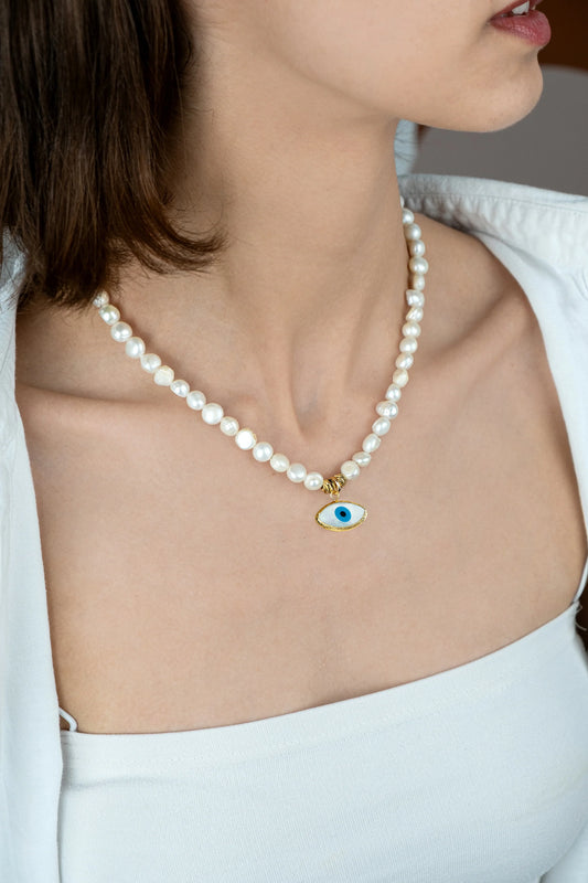 Guardian Pearl Necklace worn on a woman's chest