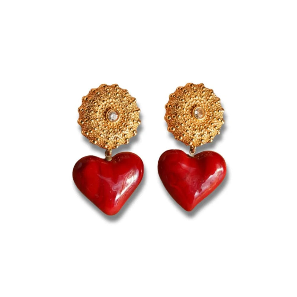 Heart-shaped earrings with gold and red design on a white background