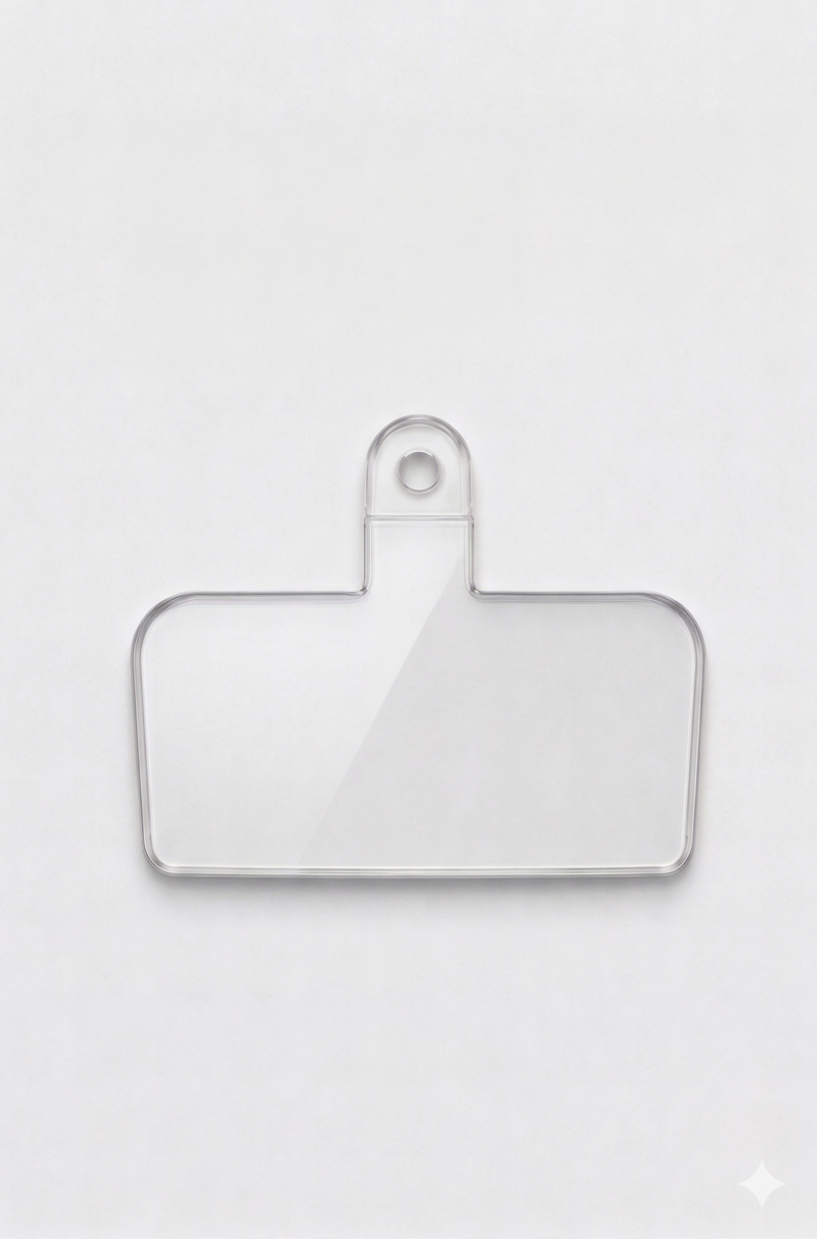 Clear plastic patch on a white background compatible with all phone cases and Charmole phone straps