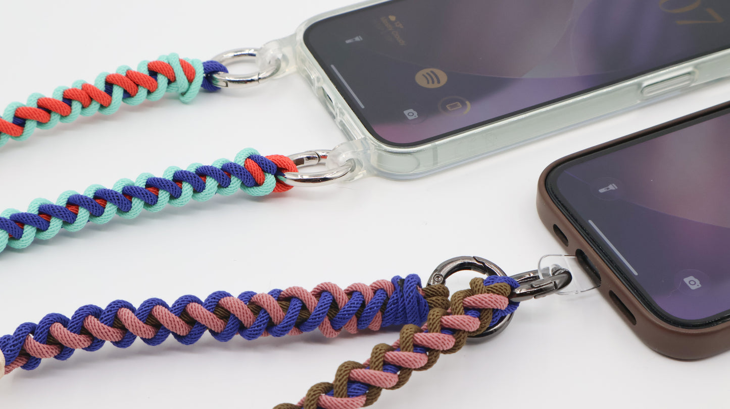 How Charmolé macramé straps connect to phones — spring clip through a clear case strap ring and direct phone attachment patch