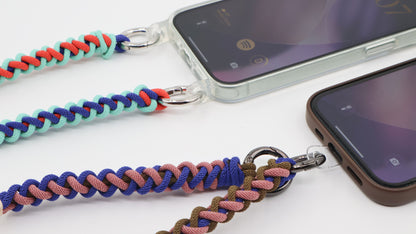 How Charmolé macramé straps connect to phones — spring clip through a clear case strap ring and direct phone attachment patch