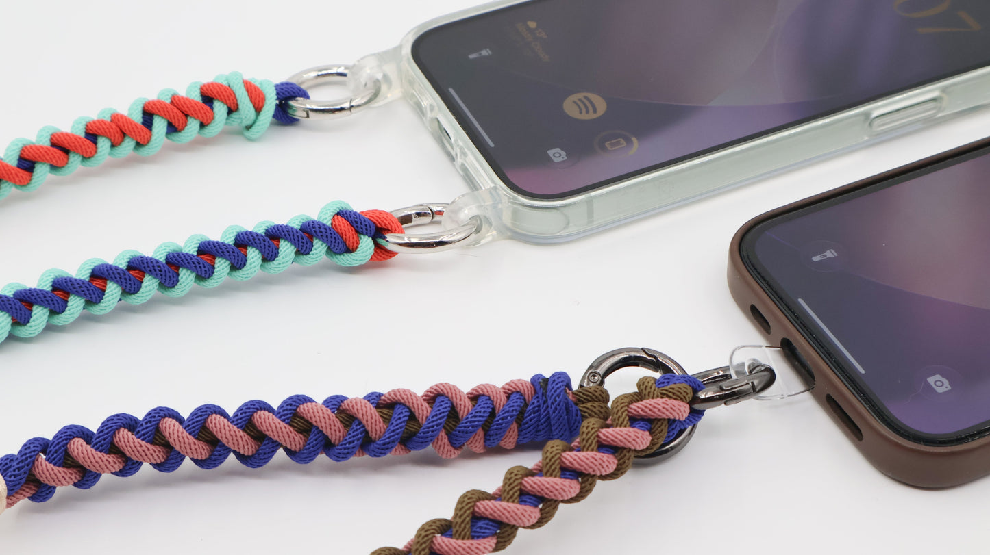 How Charmolé macramé straps connect to phones — spring clip through a clear case strap ring and direct phone attachment patch