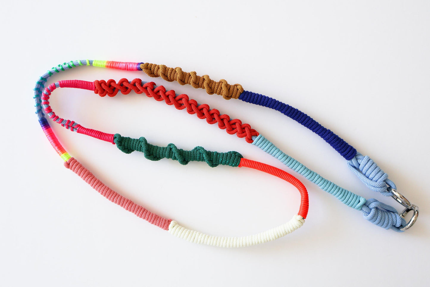 Prism Coast crossbody strap clip detail - interchangeable hardware and cord colour transition