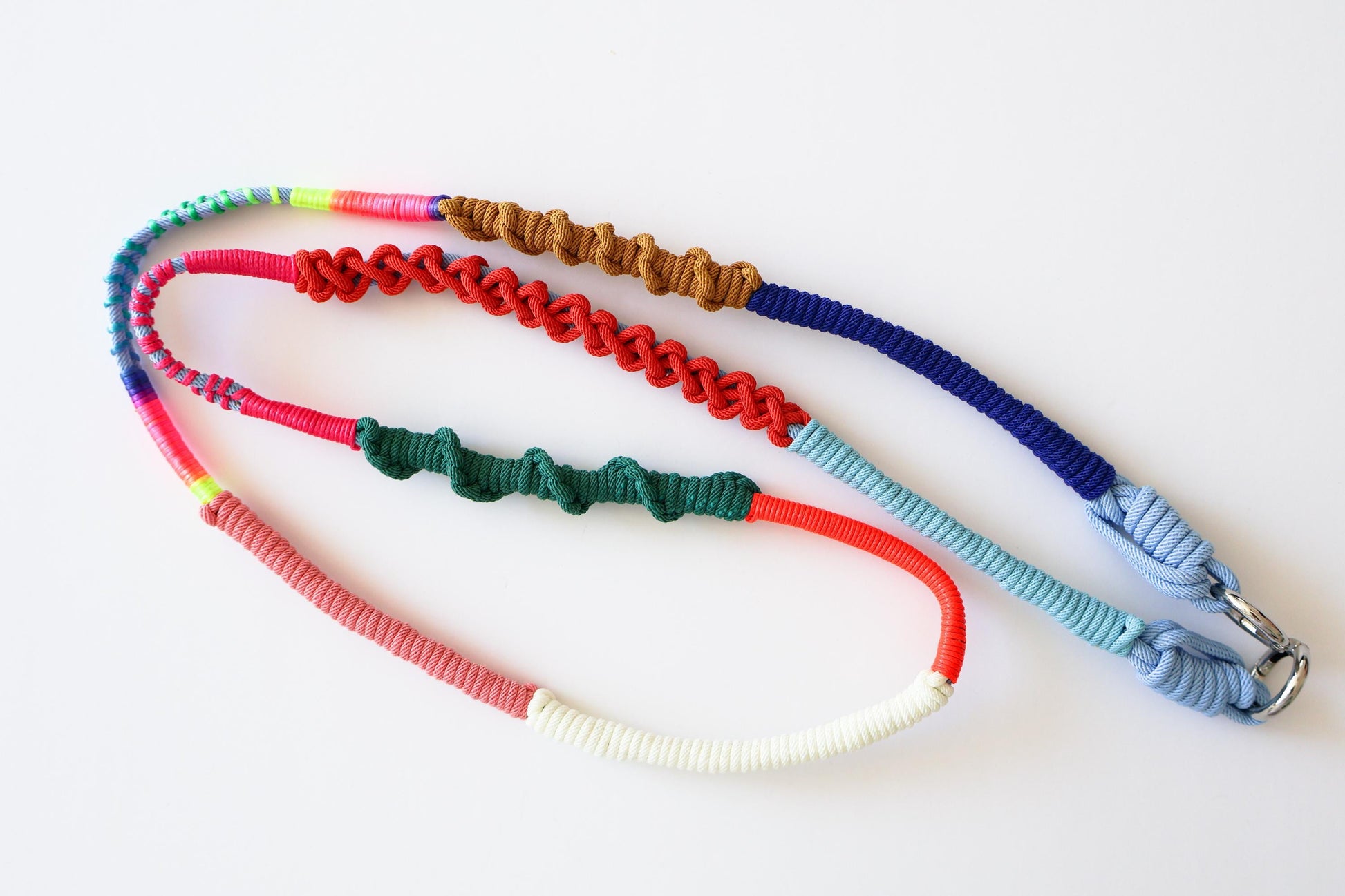 Prism Coast crossbody strap clip detail - interchangeable hardware and cord colour transition