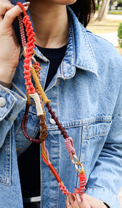 Terracotta Sand phone strap close-up — hand-knotted Milan cord in terracotta and sandy tones